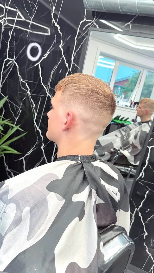 Blonde textured crop with a skin fade, side profile